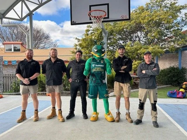 Allen Built crew on the new Rosetta Primary School court with the Tasmania JackJumpers mascot
