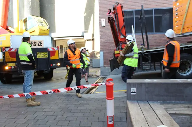 Crane lifting plant into the State Library site in Hobart